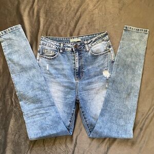 Machine distressed high-rise skinny jeans